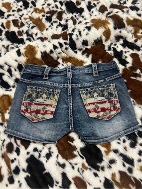 Cowgirl Tuff Blue Denim Shorts with Red, Cream, and Blue Flag-Print Pockets